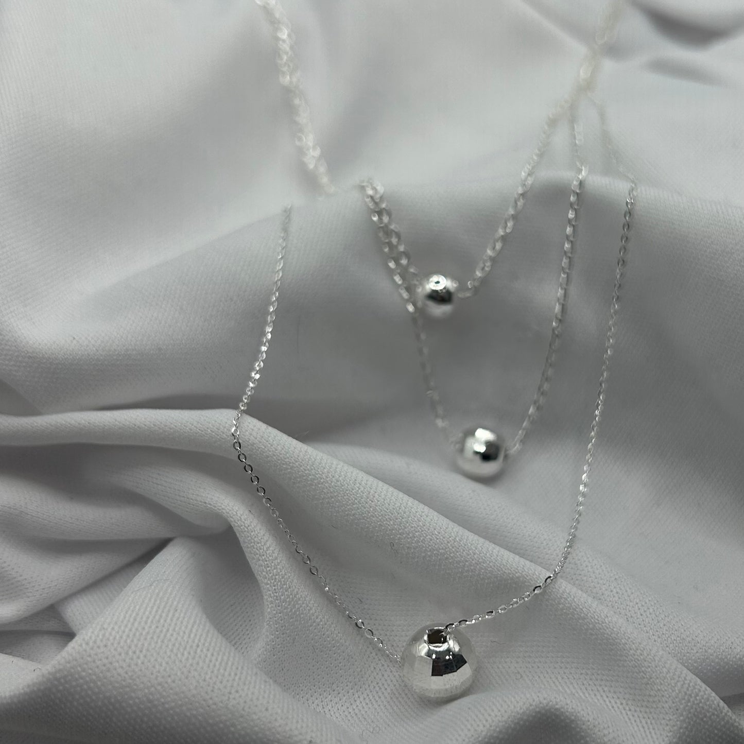 Triple Bolas (Collar triple)
